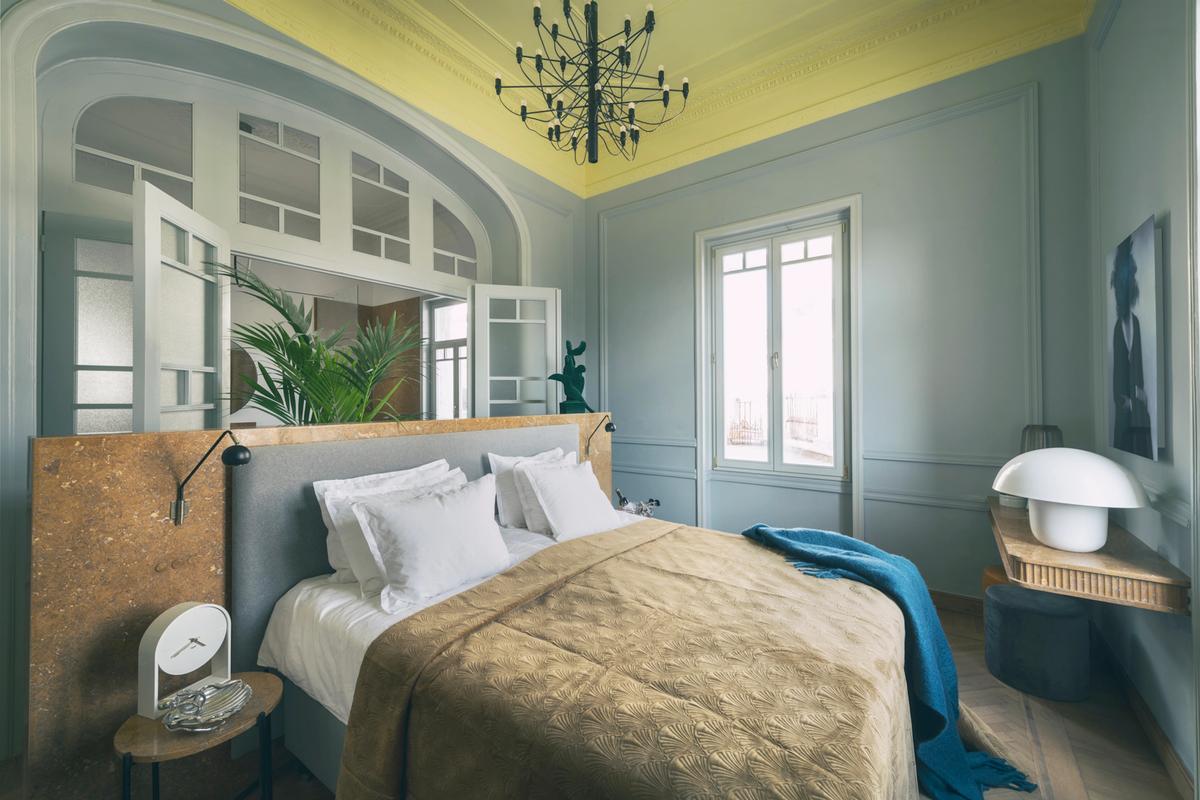 Each bedroom of the home has soaring ceilings with crown moldings and elegant light fixtures, a private bath, and is finished with a unique color and design motifs. (Courtesy of Greece Sotheby’s International Realty)