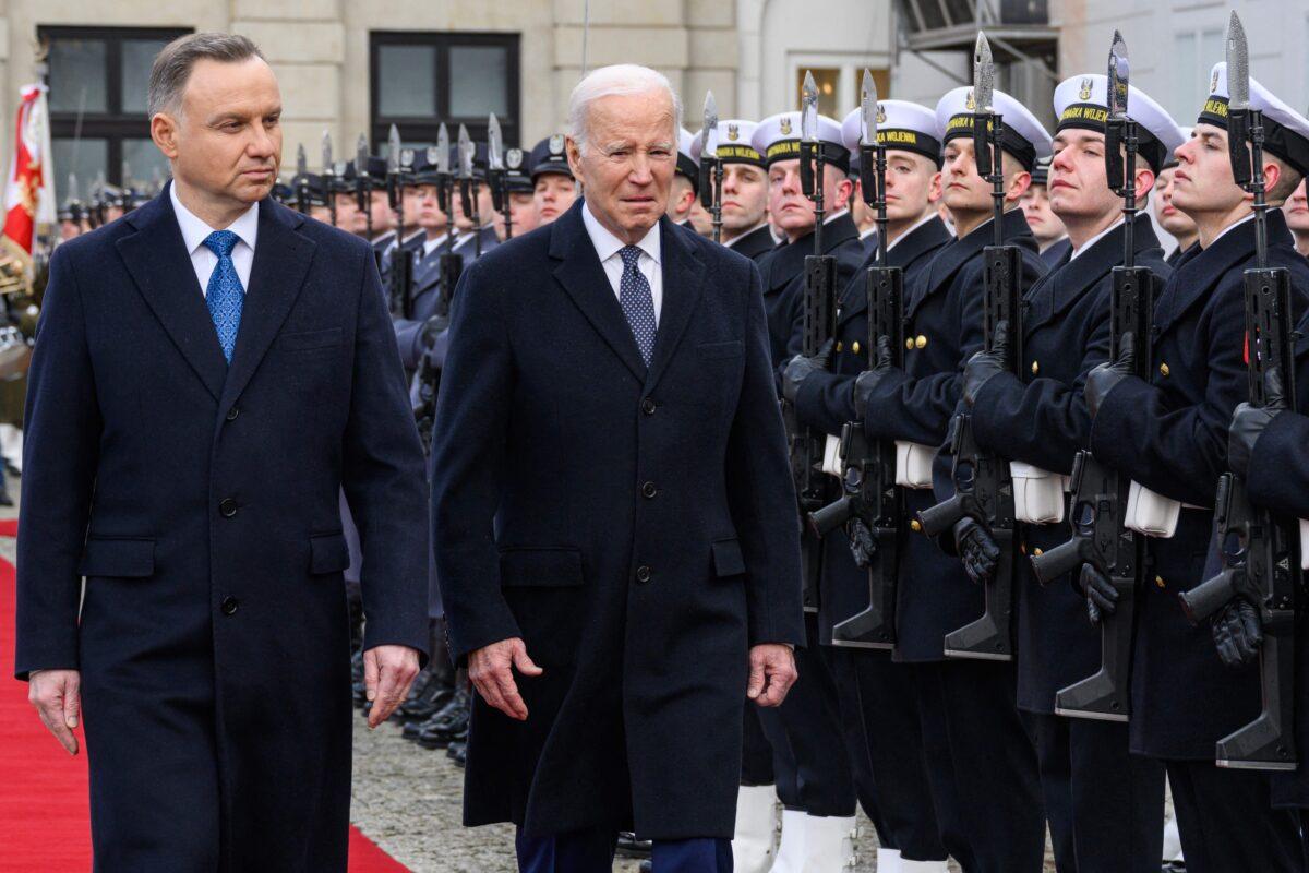 Poland's president, Andrzej Duda (L), and U.S. President Joe Biden inspect an honor guard during an arrival ceremony at the Presidential Palace in Warsaw on Feb. 21, 2023. (Mandel Ngan/AFP via Getty Images)