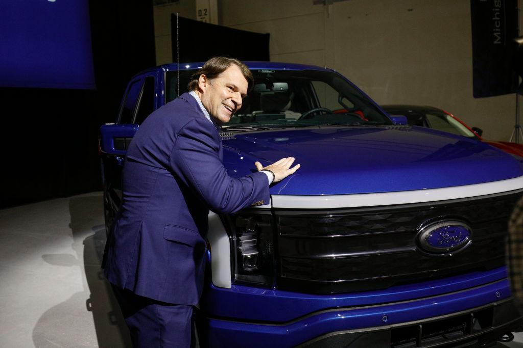 Ford CEO Jim Farley pats a Ford F-150 Lightning truck before announcing at a press conference that Ford Motor Company will be partnering with the world's largest battery company, a China-based company called Contemporary Amperex Technology, to create an electric-vehicle battery plant in Marshall, Mich., on Feb. 13, 2023. (Bill Pugliano/Getty Images)