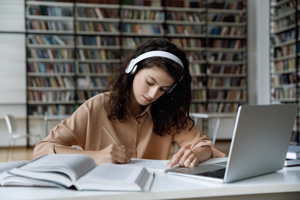 Headphones at a safe volume allow you to enjoy music in private, so you can focus without disturbing those around you. (fizkes/Shutterstock)