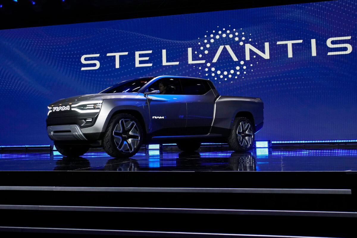 The Ram 1500 Revolution electric battery-powered pickup truck is displayed on stage during an event in Las Vegas, Nev., on Jan. 5, 2023. (John Locher/AP Photo)