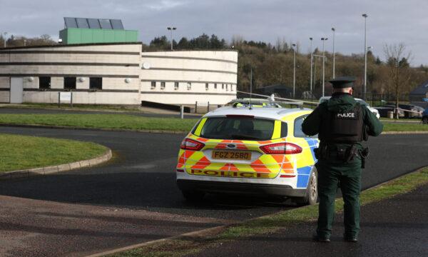 An officer of the Police Service of Northern Ireland (PSNI) is pictured on duty near the sports complex in the Killyclogher Road area of Omagh, Co. Tyrone, Northern Ireland, on Feb. 23, 2023. (PA Media)