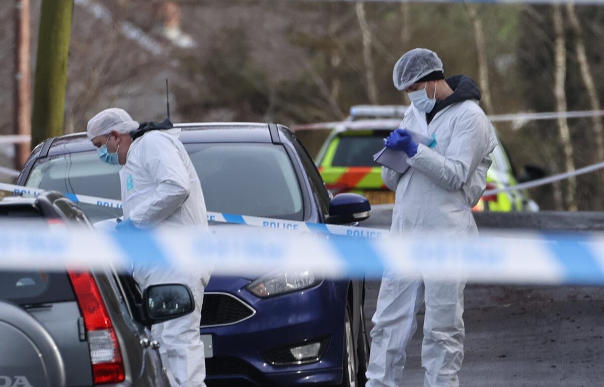 Forensic officers from the Police Service of Northern Ireland at the sports complex in the Killyclogher Road area of Omagh, Co. Tyrone, on Feb. 23, 2023. (PA Media)