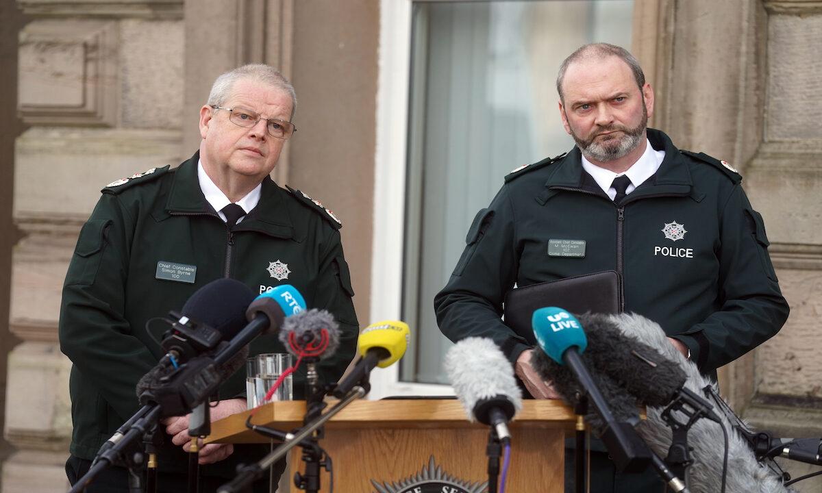 Chief Constable Simon Byrne (L) and Assistant Chief Constable Mark McEwan from the Police Service of Northern Ireland (PSNI) speak to the media outside PSNI headquarters in Belfast on Feb. 23, 2023. (PA Media)