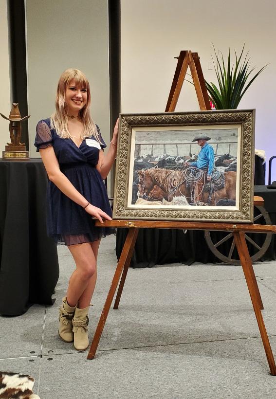 Mia Huckman stands beside her winning painting, titled "Our Last Roundup." (Courtesy of Mia Huckman)