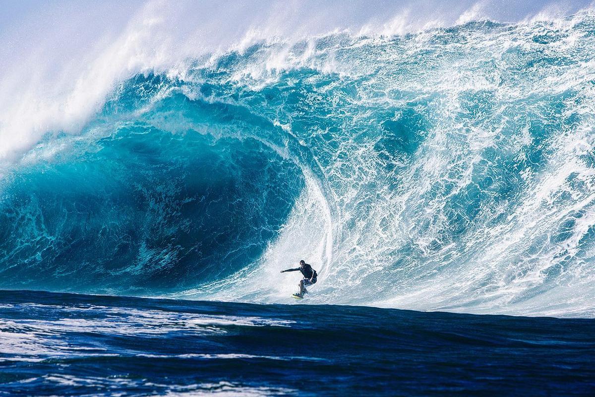 A surfer catches a mega-sized wave. (Courtesy of <a href="https://www.instagram.com/fred_pompermayer/">Fred Pompermayer</a>)