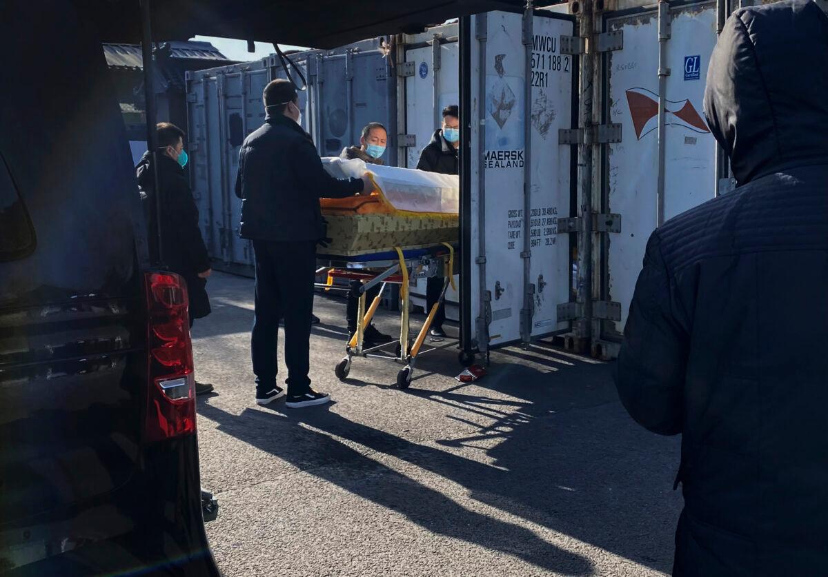 A coffin is loaded into a storage container at the Dongjiao crematorium and funeral home, one of several in the city that handles COVID-19 cases, in Beijing, on Dec. 18, 2022. (Getty Images)