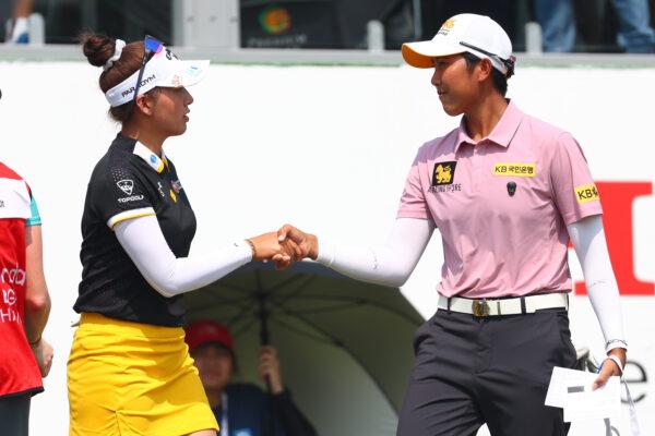 Atthaya Thitikul (L) and Natthakritta Vongtaveelap of Thailand (R) shake hand after finish 18th hole during the second round of the Honda LPGA Thailand at Siam Country Club in Chon Buri, Thailand, on Feb. 24, 2023. (Thananuwat Srirasant/Getty Images)