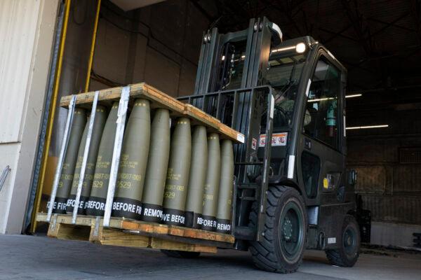 Airmen with the 436th Aerial Port Squadron use a forklift to move 155 mm shells ultimately bound for Ukraine at Dover Air Force Base, Del., on April 29, 2022. The Pentagon announced a new package of long-term security assistance for Ukraine on Feb. 24, 2023, marking the one-year anniversary of Russia's invasion with a $2 billion commitment to send more rounds of ammunition and a variety of small, high-tech drones into the fight. (Alex Brandon/AP Photo)