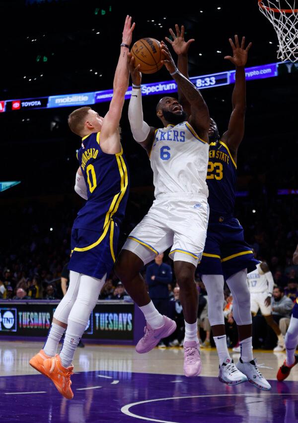 LeBron James (6) of the Los Angeles Lakers takes a shot against Donte DiVincenzo (0) and tv23in the second half in Los Angeles on Feb. 23, 2023. (Ronald Martinez/Getty Images)