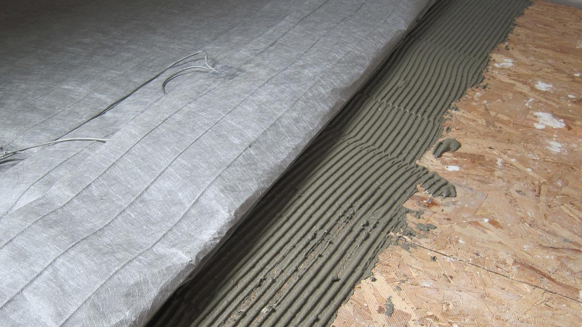 A simple mat that contains safe electric heating cables can be put under ceramic tile or even laminate flooring. It’s absolutely DIY friendly. (Tim Carter/Tribune Content Agency)