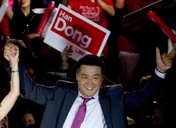 Han Dong, now a federal Liberal MP, celebrating with supporters as a provincial Liberal candidate in the Toronto area on May 22, 2014. (Nathan Denette/The Canadian Press)