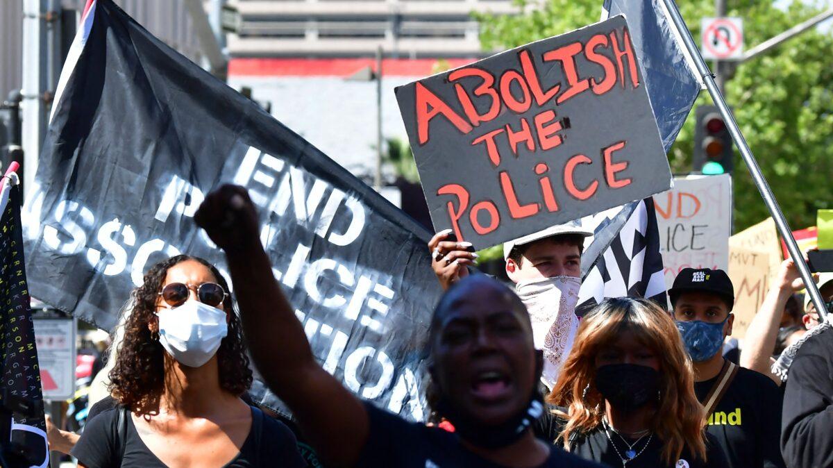 Activists march on the one-year anniversary of George Floyd's death in Los Angeles on May 25, 2021. (Frederic J. Brown/AFP via Getty Images)