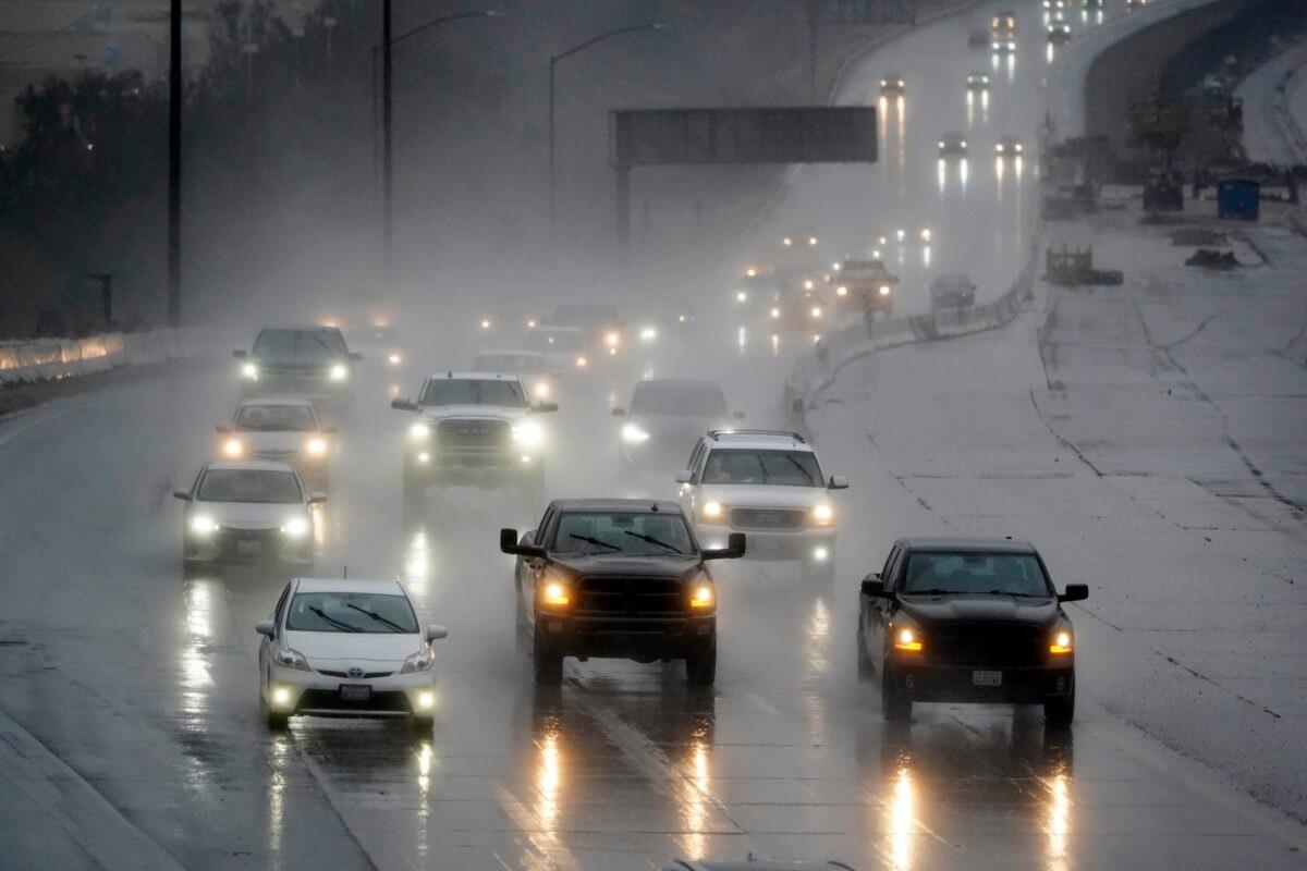 Traffic makes its way along interstate 5 during a rainstorm in Santa Clarita, Calif., on Feb. 24, 2023. (Marcio Jose Sanchez/AP Photo)