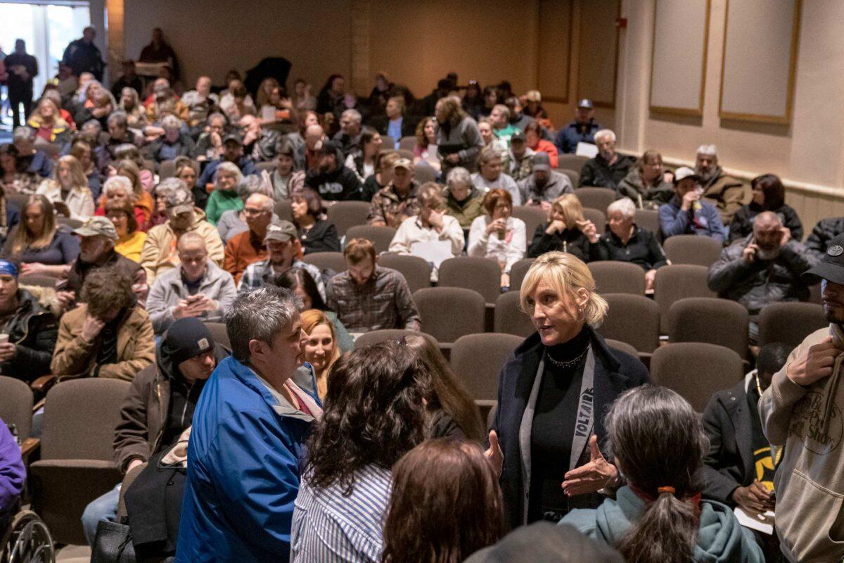 Environmental activist Erin Brockovich (C-R) speaks to concerned residents as she hosts a town hall at East Palestine High School in East Palestine, Ohio, on Feb. 24, 2023. (Michael Swensen/Getty Images)