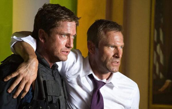 Mike Banning (Gerard Butler, L) was once on good terms with U.S. President Benjamin Asher (Aaron Eckhart), in “Olympus Has Fallen.” (Millennium Films)