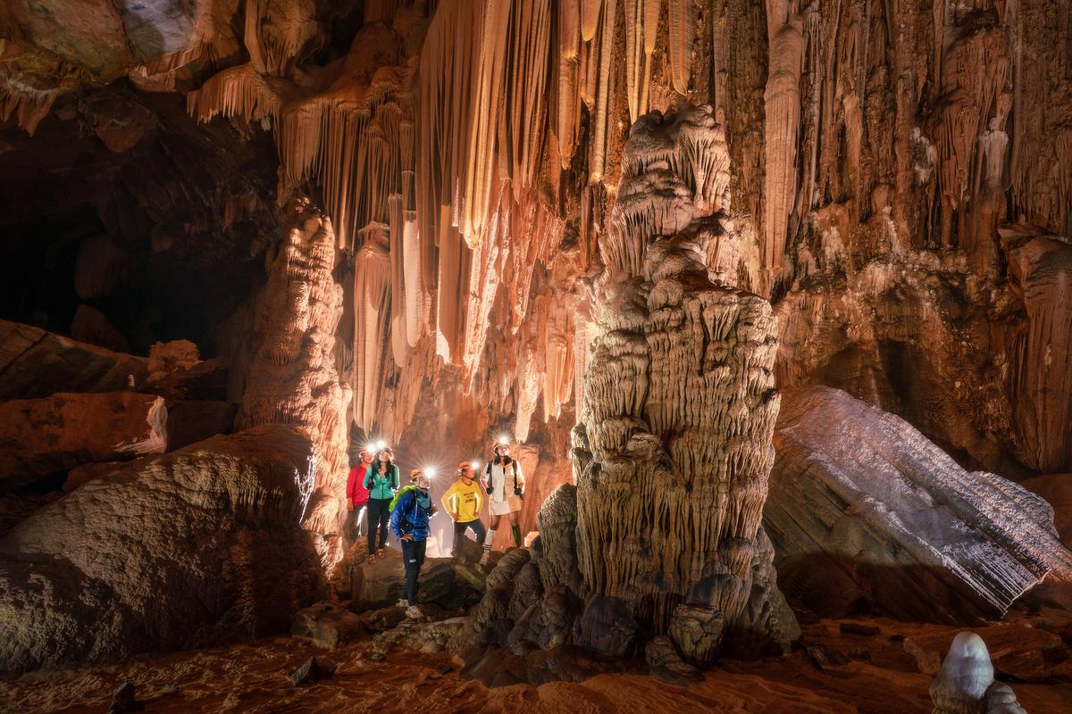 A group of explorers inside Hung Cave. (Courtesy of Cao Ky Nhan via Jungle Boss Tours)