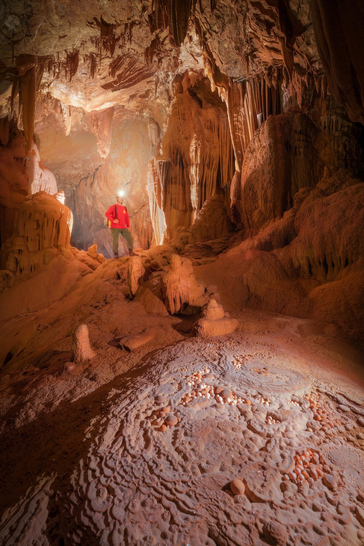 An explorer inside Hung Cave. (Courtesy of Cao Ky Nhan via Jungle Boss Tours)