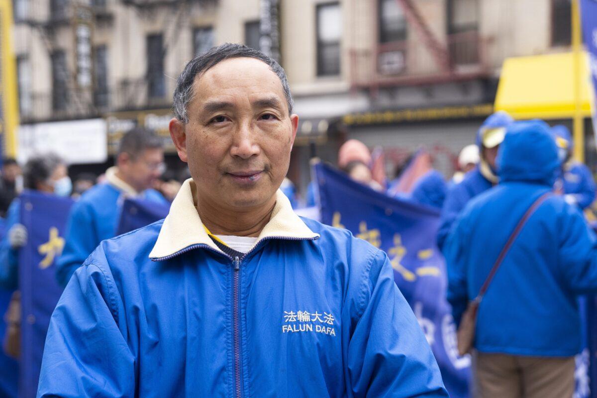 Falun Gong practitioner Wang Yongsheng walks in a parade in Brooklyn, N.Y., highlighting the Chinese regime's persecution of their faith on Feb. 26, 2023. (Chung I Ho/The Epoch Times)