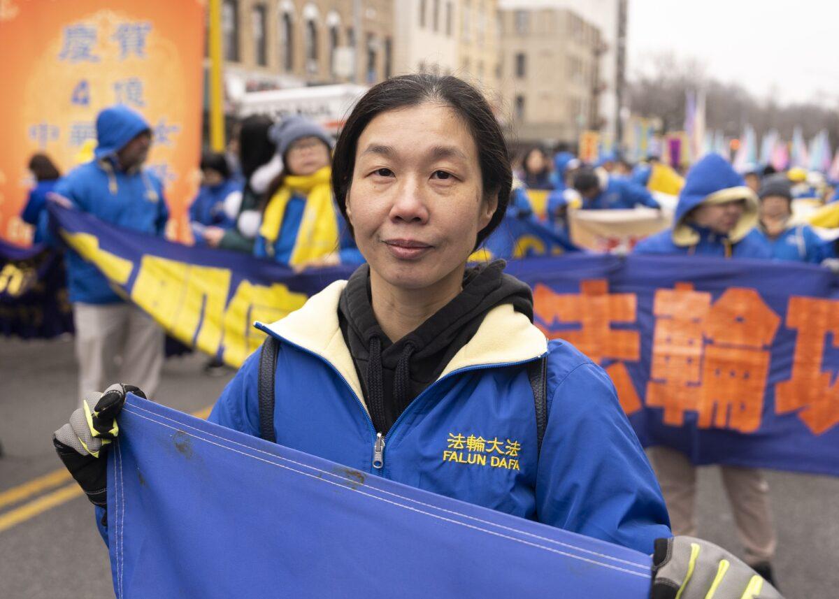 Falun Gong practitioner Li Yongxian walks in a parade in Brooklyn, N.Y., highlighting the Chinese regime's persecution of their faith on Feb. 26, 2023. (Chung I Ho/The Epoch Times)