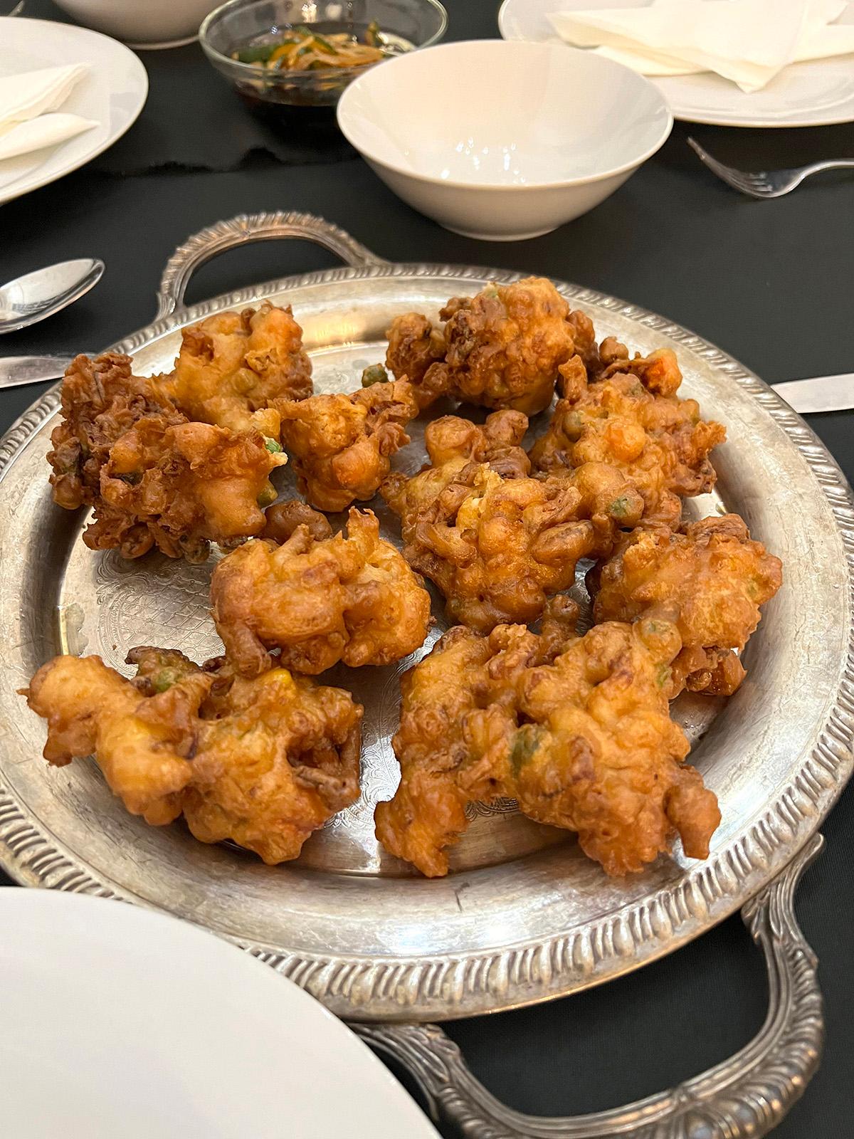 An offshoot of the American fritter, Chamorro shrimp patties (bunelos huang) are a favorite food on the island of Guam. (Gretchen McKay/Pittsburgh Post-Gazette/TNS)