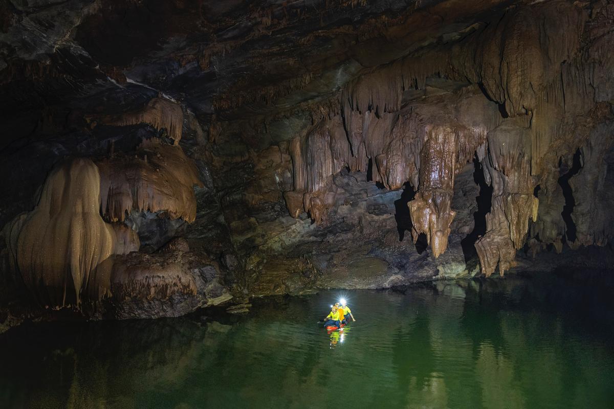 Boaters explore Tron Cave. (Courtesy of Nguyen Hai via Jungle Boss Tours)