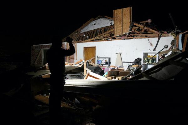 Chandler Browning looks over his in-laws' home that was destroyed by a tornado after a tornado in Norman, Okla., on Feb. 27, 2023. (Nick Oxford/Reuters)