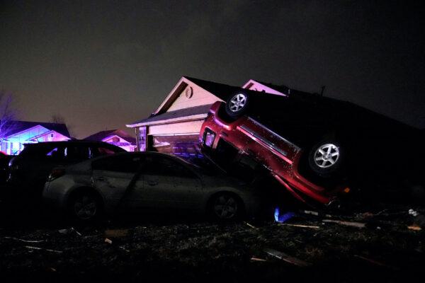 Cars that were hit by a tornado lay in a pile in a damaged neighborhood in Norman, Okla., on Feb. 27, 2023. (Nick Oxford/Reuters)