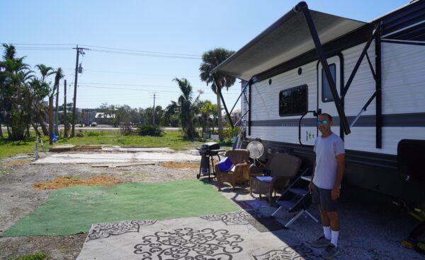 Jeff Funchion lost his home of 14 years at Cottage Point and now lives in a FEMA trailer, hoping someone will buy his lot with its empty cement pad. (John Haughey/The Epoch Times)