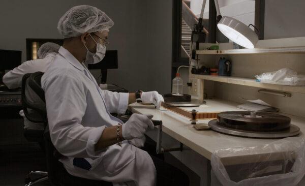 A technician at work preserving deteriorating films in "Film, the Living Record of Our Memory." (El Grifilm Productions)