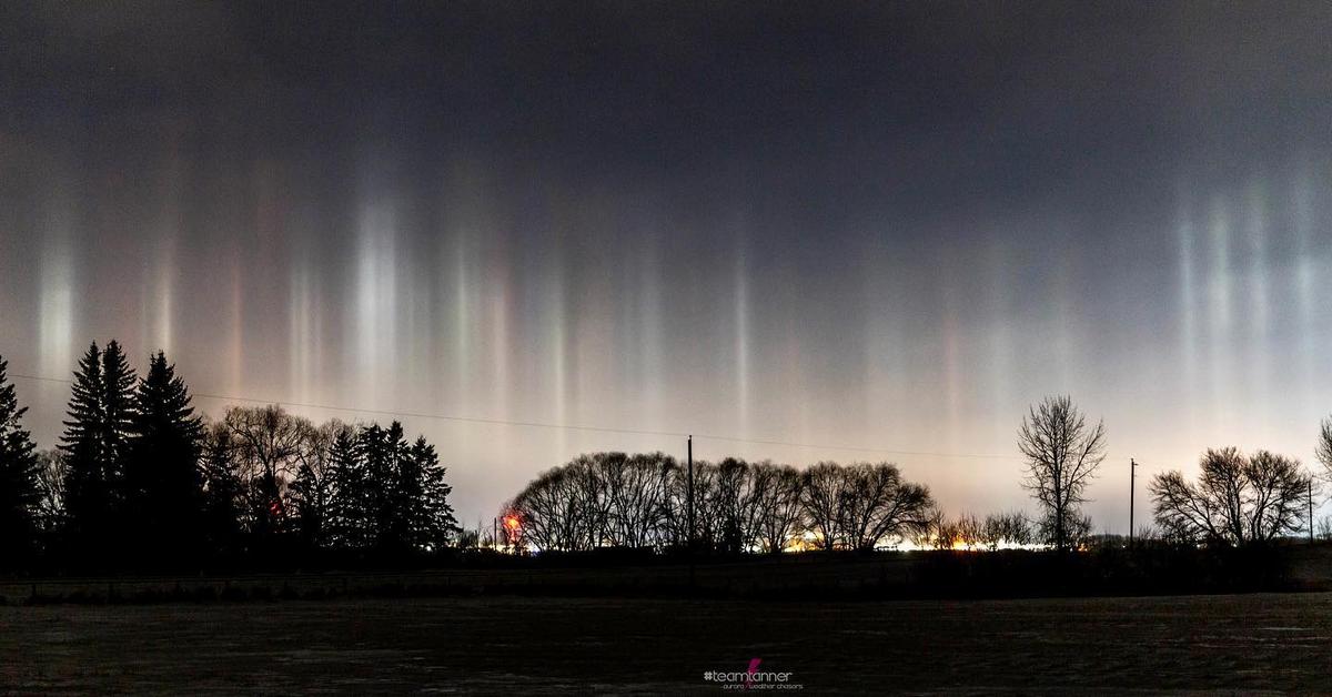 Light pillars appear overhead in central Alberta, Canada. (Courtesy of <a href="https://www.instagram.com/dartanner/">Dar Tanner</a>)