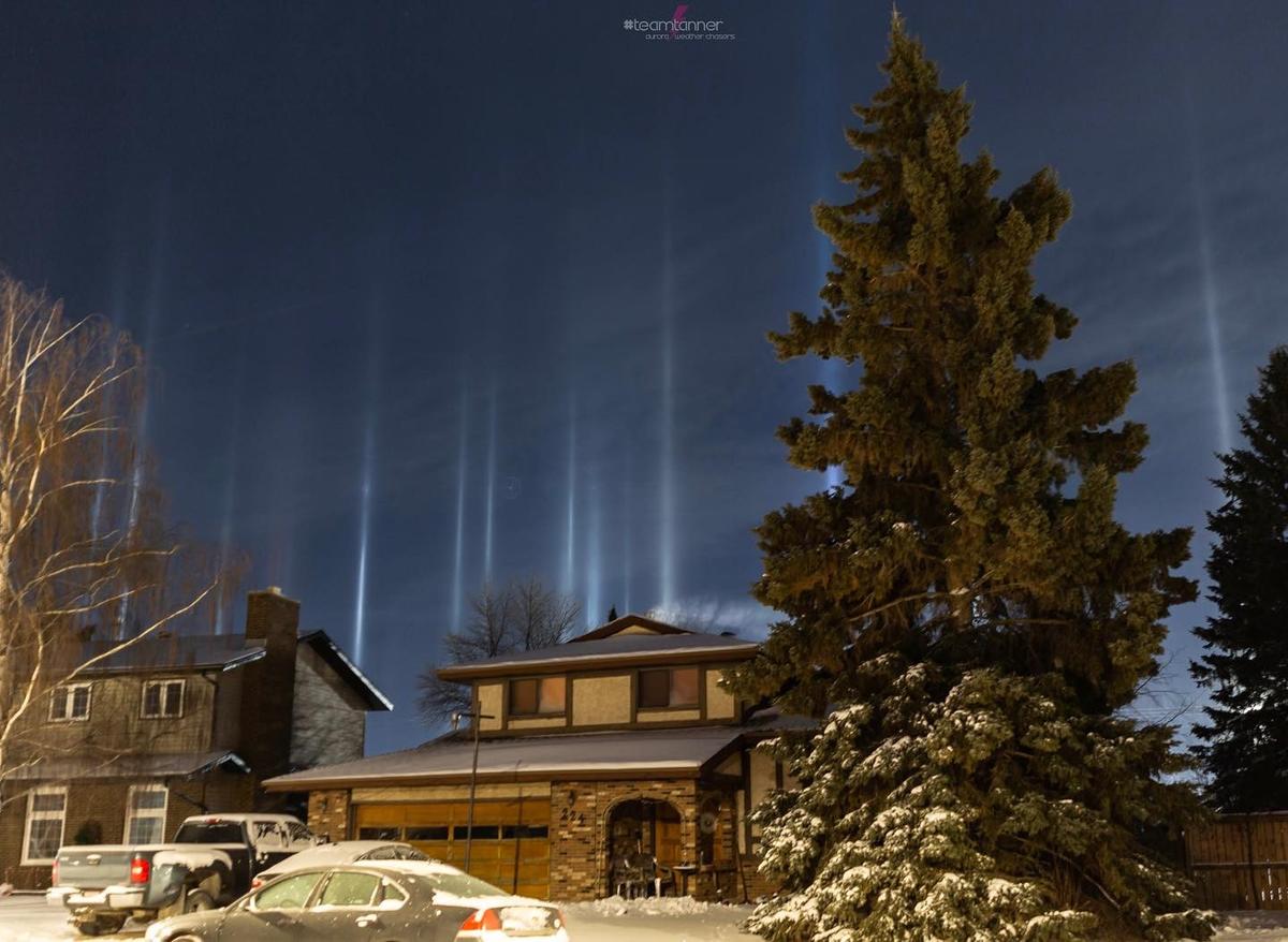 Light pillars appear over a residential area in central Alberta, Canada. (Courtesy of <a href="https://www.instagram.com/dartanner/">Dar Tanner</a>)