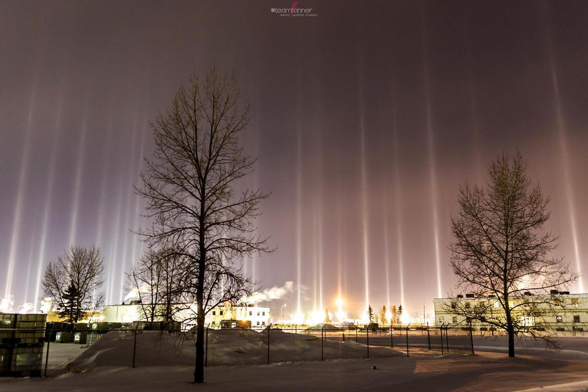 Light pillars appear in the sky over a rural compound. (Courtesy of <a href="https://www.instagram.com/dartanner/">Dar Tanner</a>)
