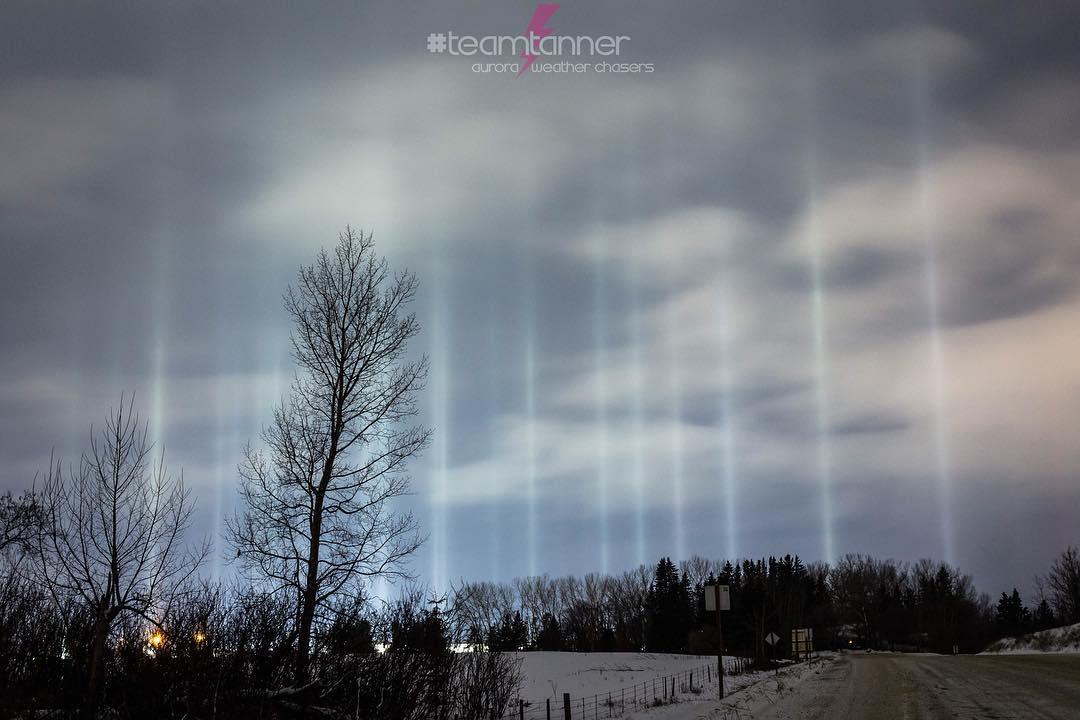 Light pillars appear over a country road in central Alberta, Canada. (Courtesy of <a href="https://www.instagram.com/dartanner/">Dar Tanner</a>)
