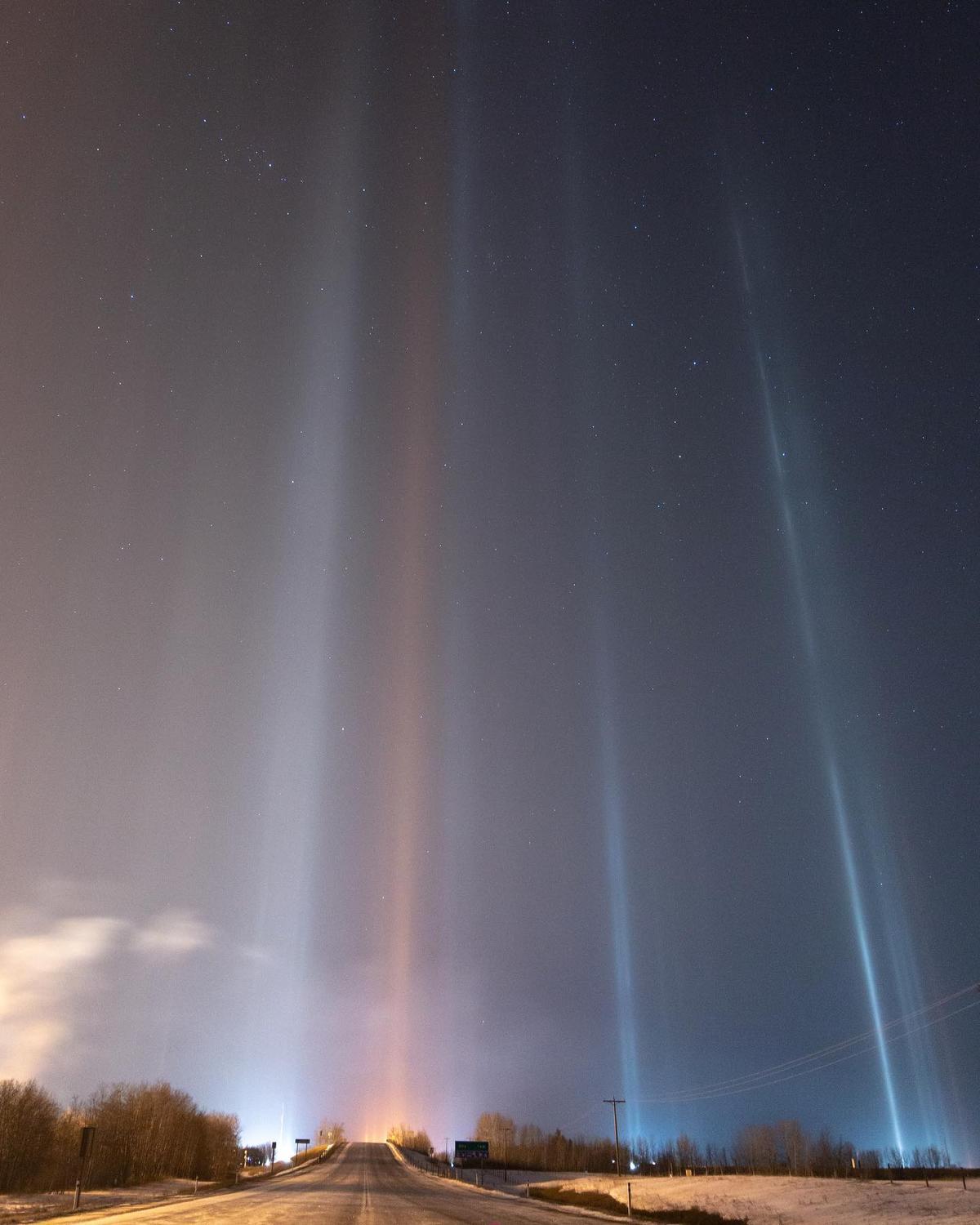 Light pillars photographed over a country road in Alberta, Canada. (Courtesy of <a href="https://www.instagram.com/dartanner/">Dar Tanner</a>)