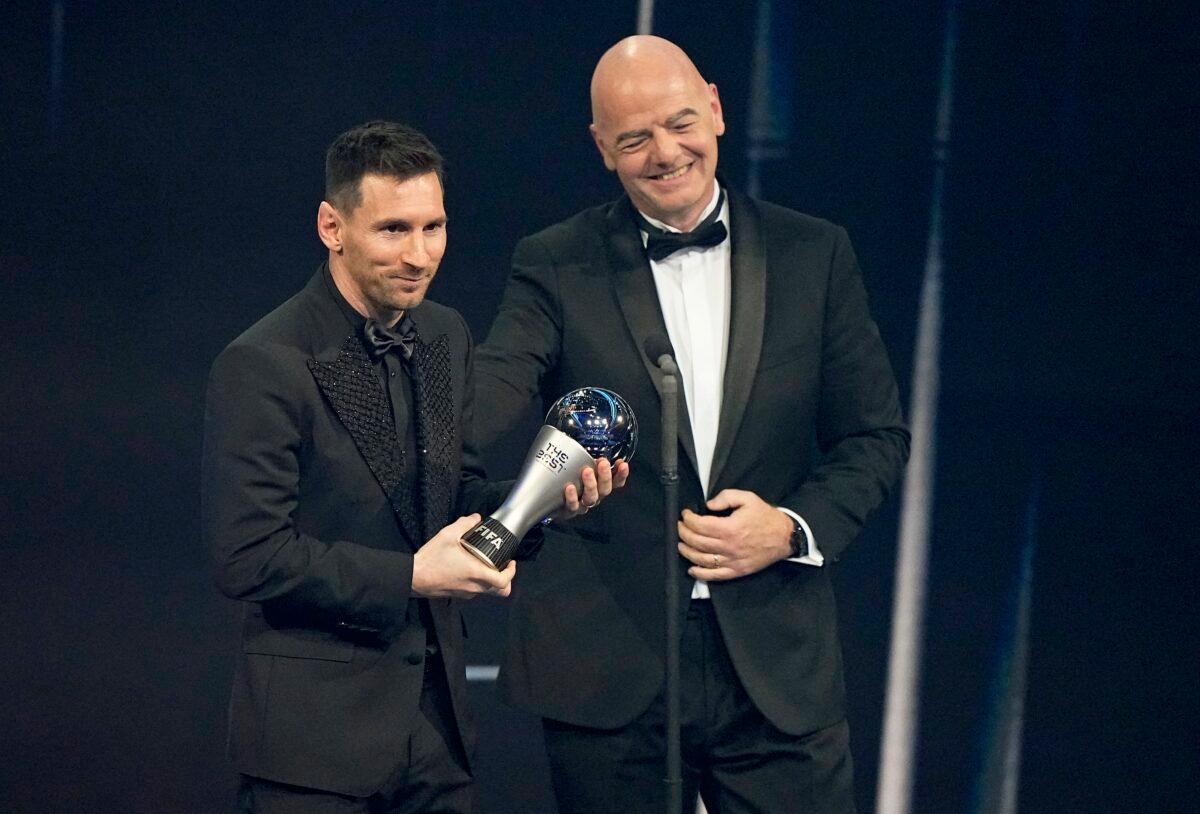 Argentina's Lionel Messi (L) receives the Best FIFA Men's player award from FIFA president Gianni Infantino during the ceremony of the Best FIFA Football Awards in Paris, France, on Feb. 27, 2023. (Michel Euler/AP Photo)