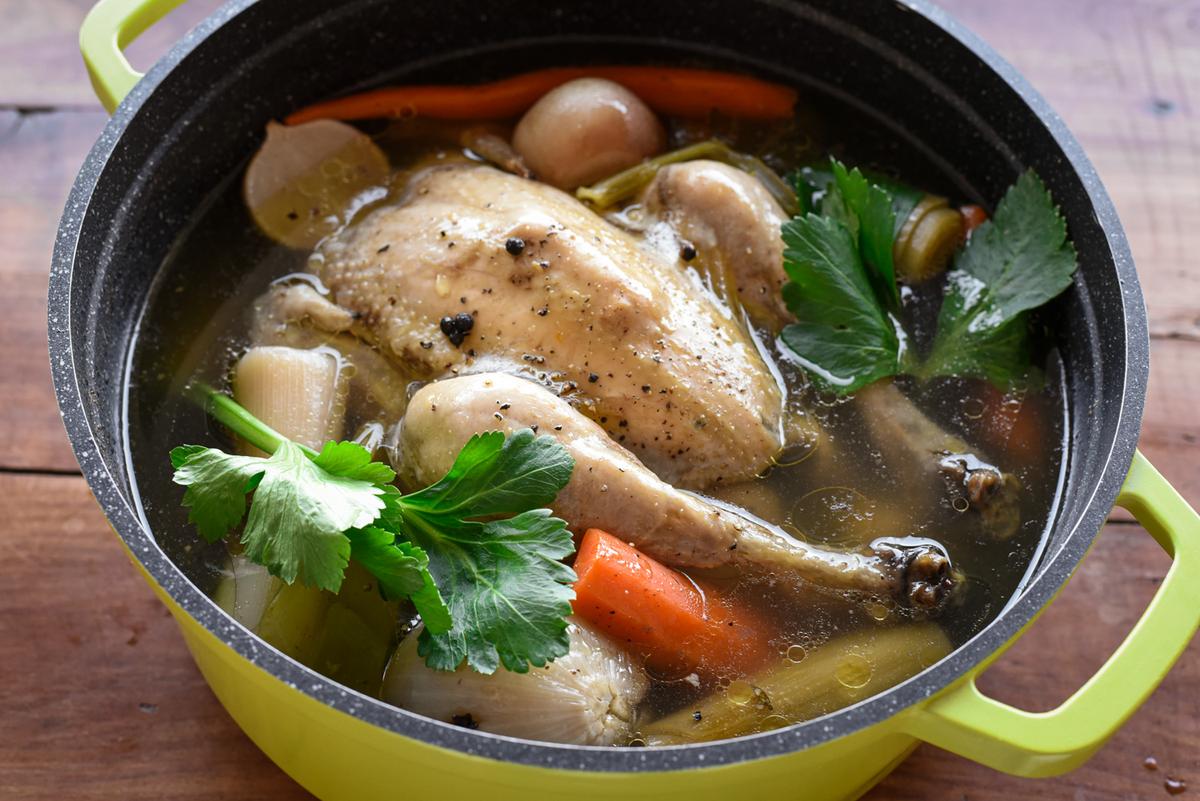 Lower the heat, cover with a lid, and simmer for 2 1/2 hours, until the chicken is fully tender. (Audrey Le Goff)
