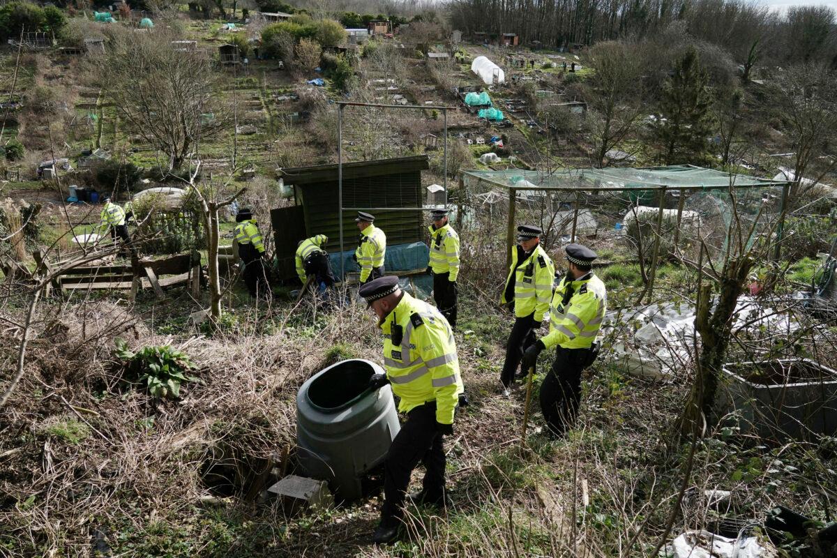 Police officers work in an urgent search operation to find the missing baby of Constance Marten, who has not had any medical attention since birth in early January, in Roedale Valley Allotments, Brighton, UK, on Feb. 28, 2023. (Jordan Pettitt/PA via AP)
