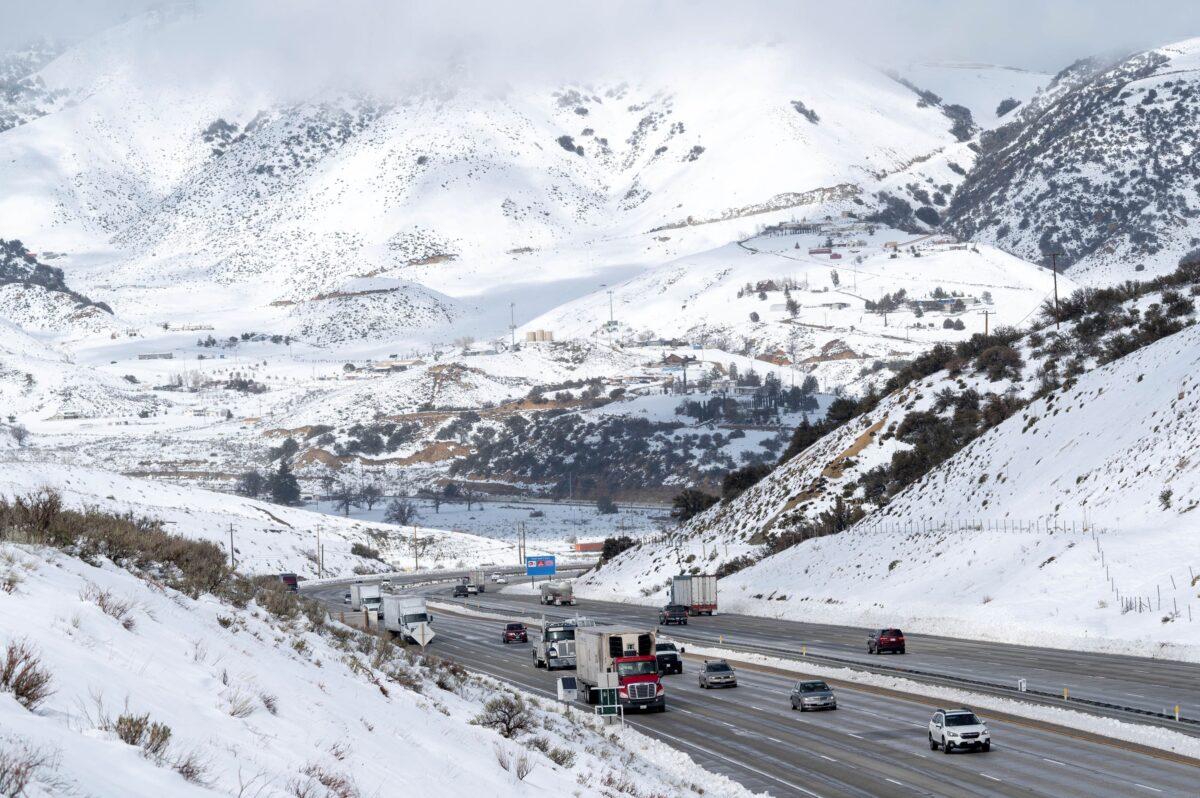 Snow surrounds the I-5 freeway through Gorman, Calif., on Feb. 27, 2023. (David Crane/The Orange County Register via AP)