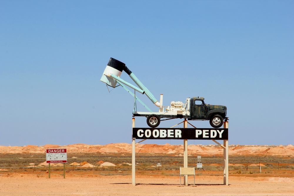An eye-catching sign marks the spot today that has become quite a tourist attraction, and was even featured in "Mad Max 3: Beyond Thunderdome.". (ingehogenbijl/Shutterstock)
