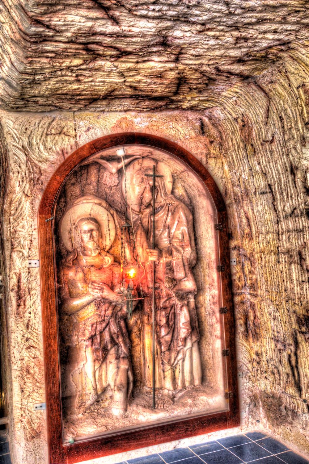An ornate carving in Coober Pedy features religious-themed subject matter. (AdamDWilson/Shutterstock)