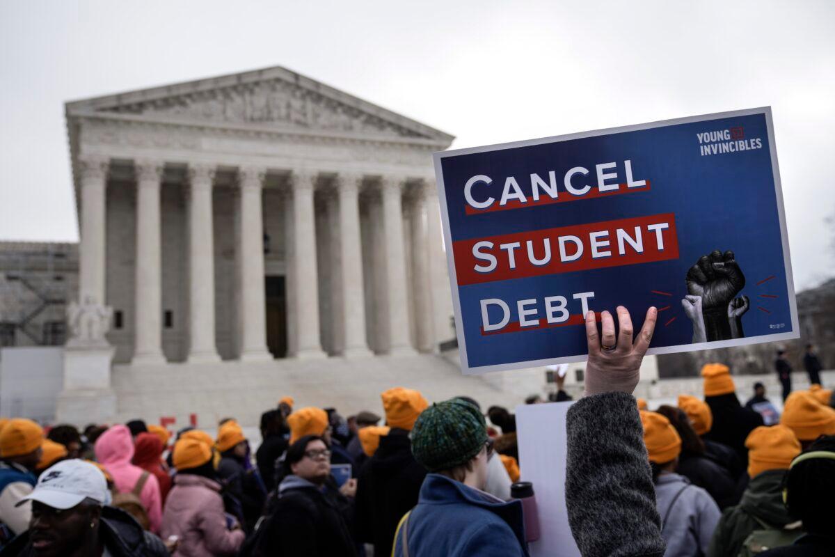 People rally in support of the Biden administration's student debt relief plan in front of the the U.S. Supreme Court in Washington on Feb. 28, 2023. (Drew Angerer/Getty Images)