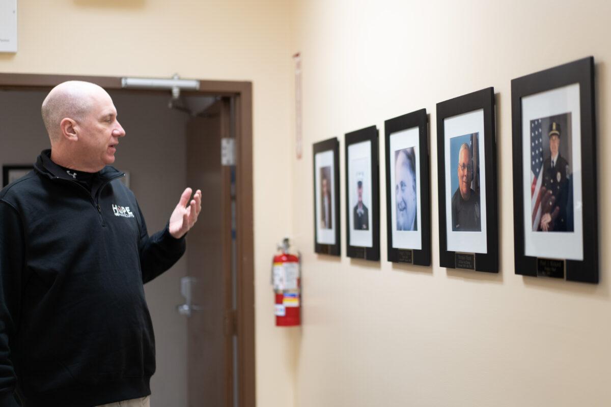 Mount Hope Police Chief Paul Rickard talks about the pictures of past police chiefs he set up in the department in Otisville, N.Y., on Feb. 24, 2023. (Cara Ding/The Epoch Times)