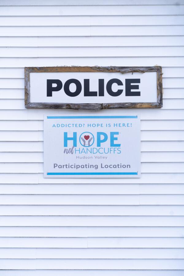 A sign for the Hope Not Handcuffs program outside Mount Hope Police Department in Otisville, N.Y., on Feb. 24, 2023. (Cara Ding/The Epoch Times)