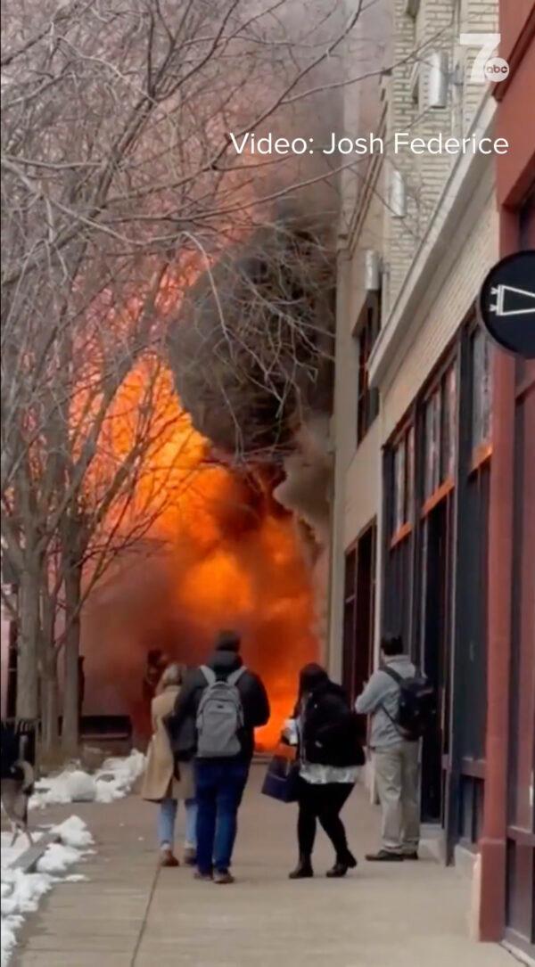 Flames shoot across the sidewalk at a fire in a building in Buffalo, N.Y., on March 1, 2023. (Josh Federice/WKBW via AP)