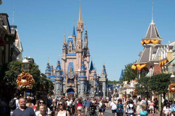 Visitors walk along Main Street at The Magic Kingdom of Walt Disney World in Orlando, Fla., on Sept. 30, 2022. (Bryan R. Smith/AFP via Getty Images)