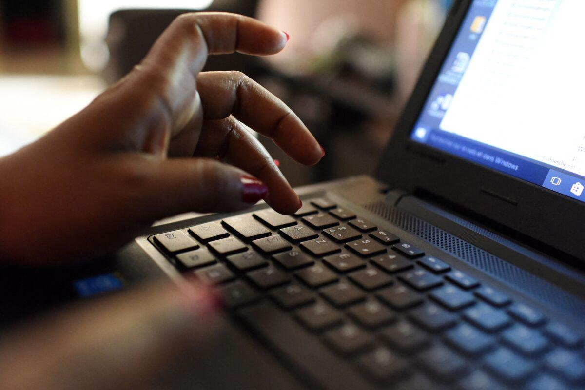 A woman uses a laptop in Abidjan on April 3, 2019. (Issouf Sanogo/AFP via Getty Images)