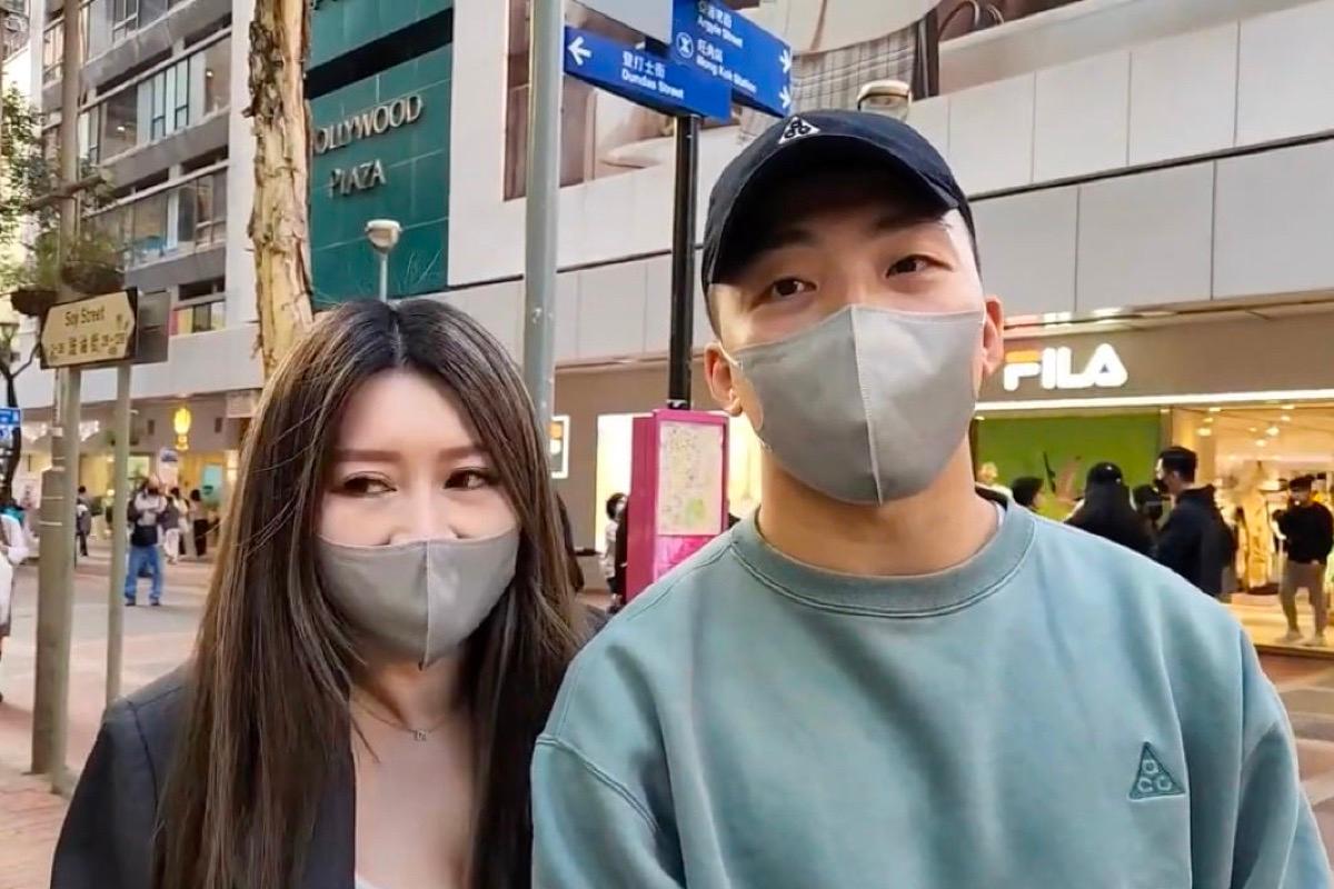 Two citizens were interviewed in Mong Kok on Feb. 28 and said they would not wear masks from March 1. (Screenshot from The Epoch Times video)