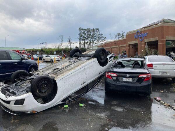 A car is upturned in a Kroger parking lot after a severe storm swept through Little Rock, Ark., on March 31, 2023. (Andrew DeMillo/AP Photo)