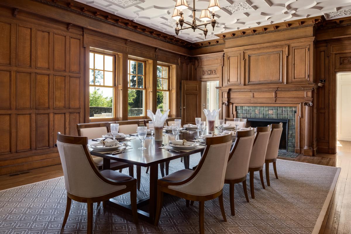 The formal dining room is paneled in fine hardwood and features a plaster tracery ceiling. (Daniel Milstein for Sotheby’s International Realty)